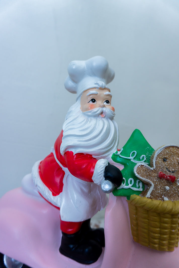 Santa on Pink Vespa