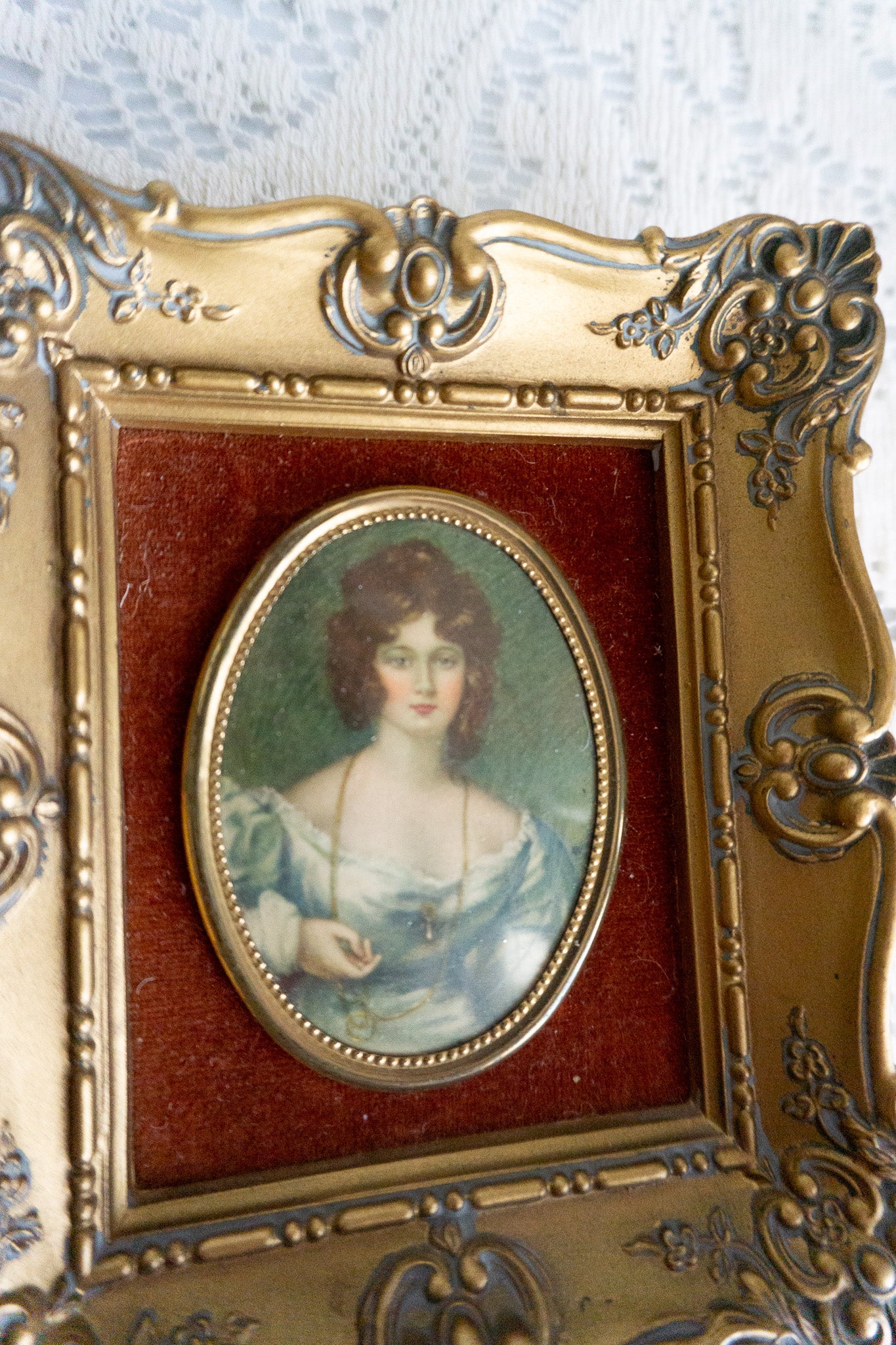 Cameo Creation wall art featuring 'Mrs. Croker' by Vincent Nesbert in a gold baroque-style frame with a rust velvet backdrop.