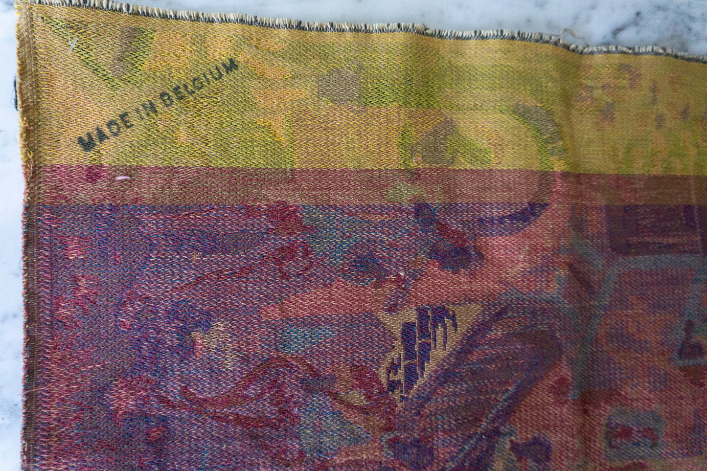 Backside of the vintage Belgian tapestry showing the "Made in Belgium" mark.