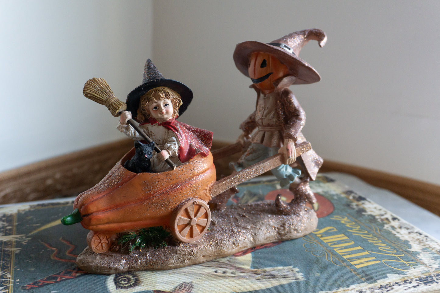 Scarecrow and Child in Wheelbarrow Figurine