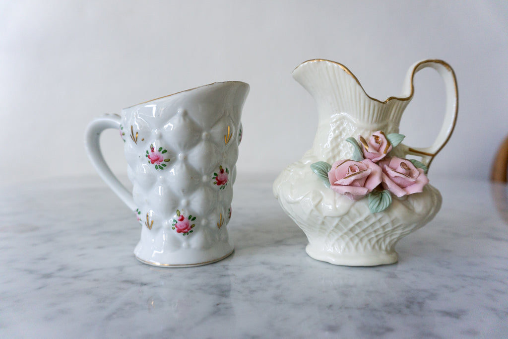Close-up of quilted floral pitcher with pink roses and gold accents