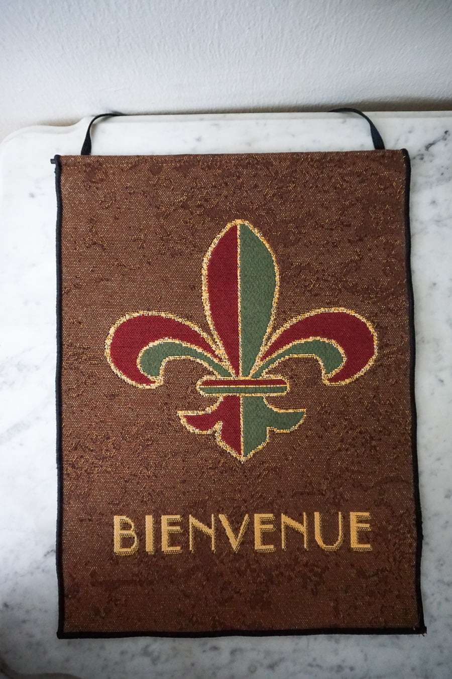 Full view of Fleur-de-Lis 'Bienvenue' tapestry wall hanging, showcasing its elegant design and size.