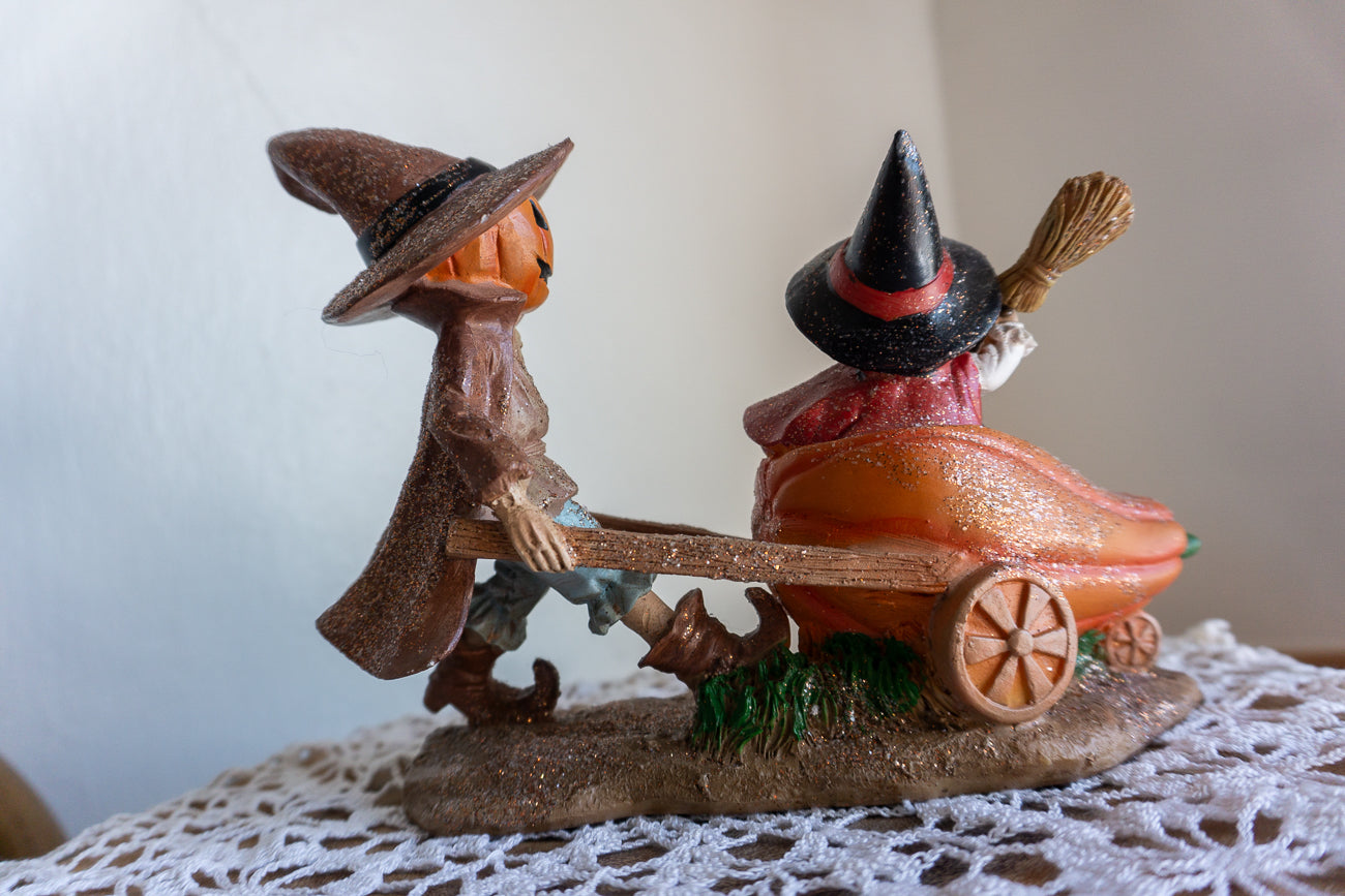 Scarecrow and Child in Wheelbarrow Figurine