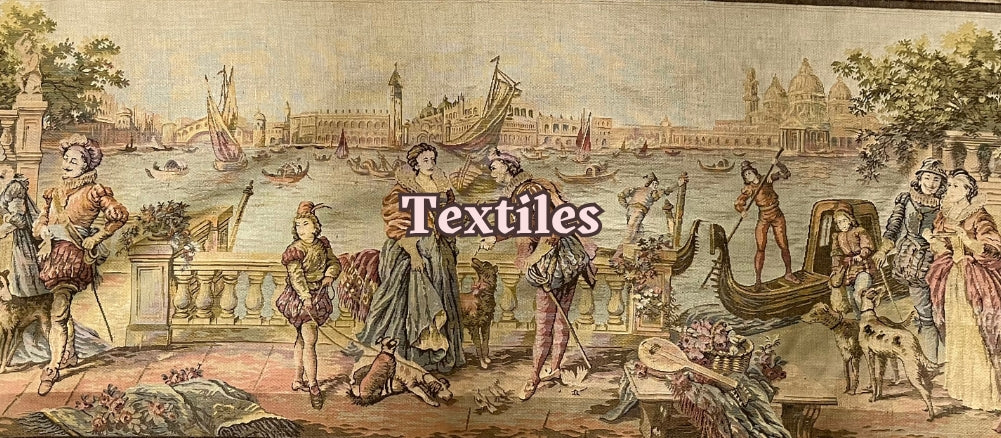 Curated collection of vintage textiles such as tablecloths and tea towels