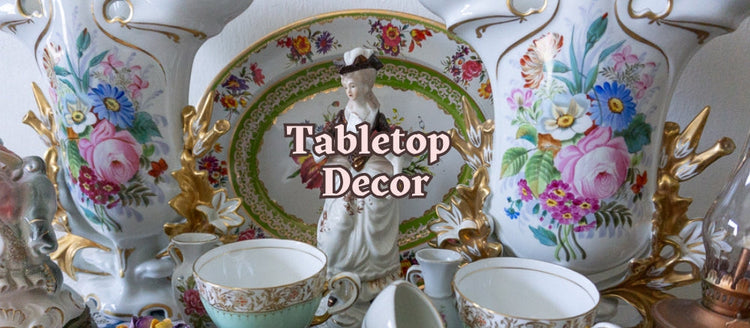 Vintage tabletop decor collection featuring porcelain figurines, decorative objects, and knick knacks