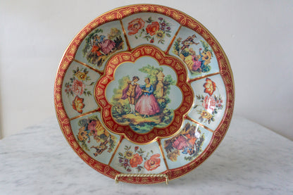 Close-up view of the Daher Decorated Ware plate showcasing romantic scenes and floral motifs.