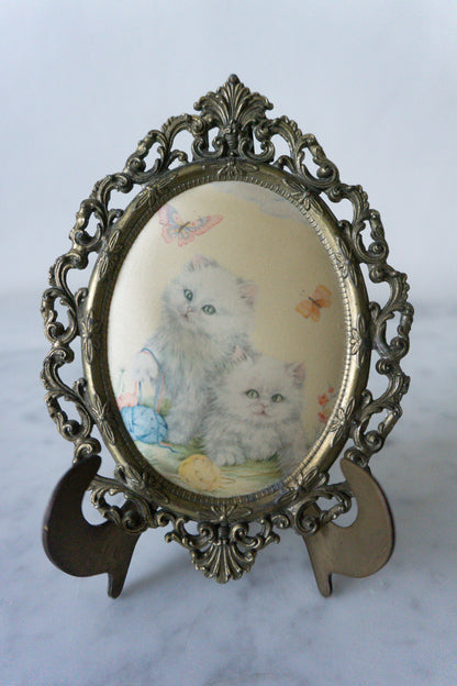 Front view of the Vintage Oval Picture Silk Print with Kitties and Butterflies in a Filigree Brass Frame.