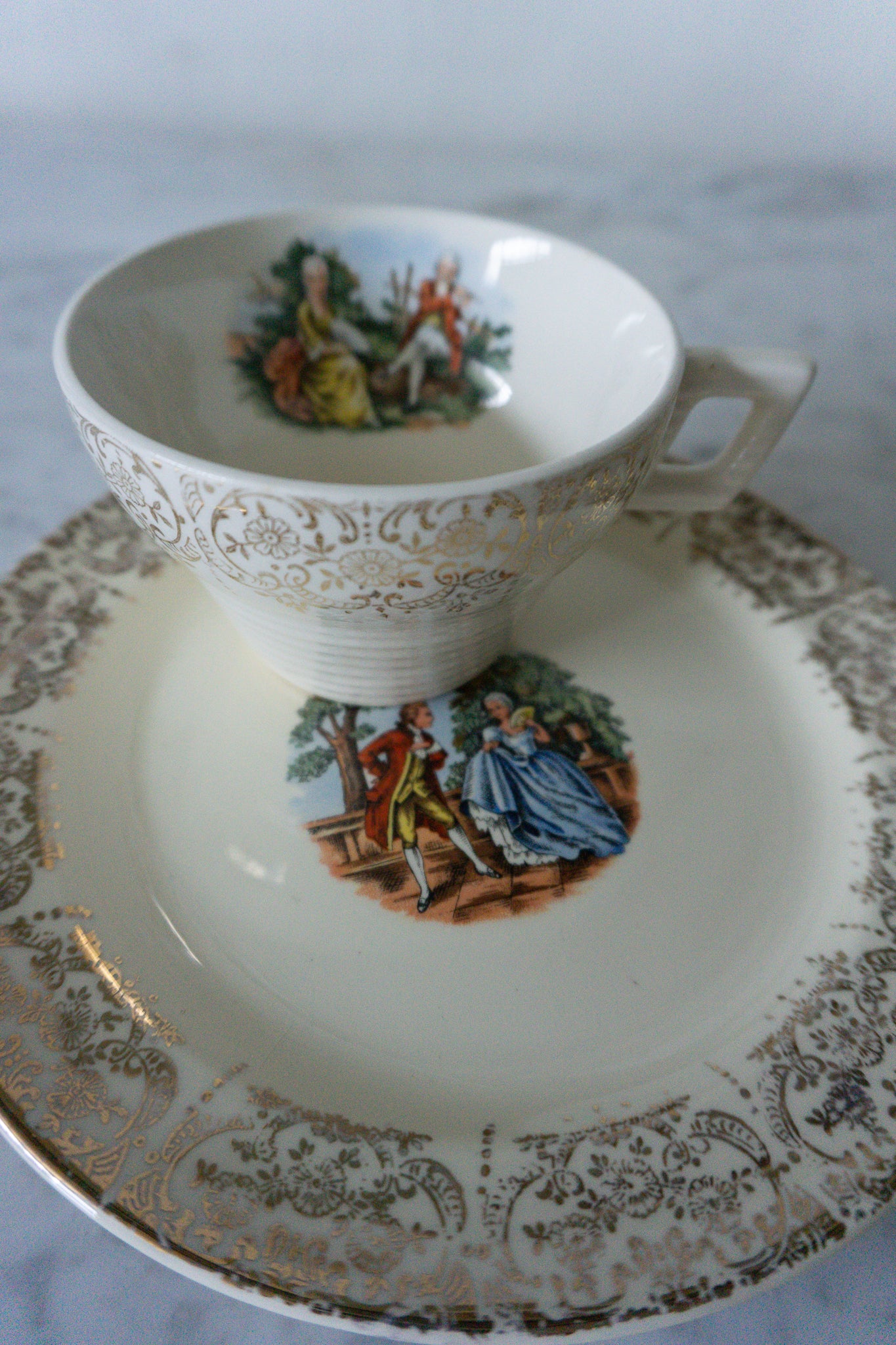 French Courting Scene Flat Cup & Saucer Set