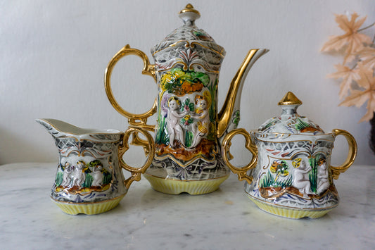 Vintage Pereiras Valado hand-painted porcelain tea set with gold gilded cherub designs