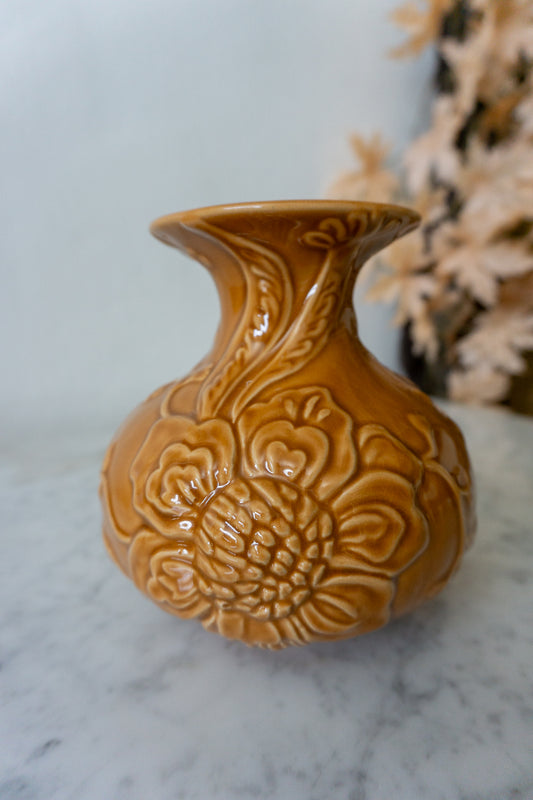 Close-up view of the House of Hackney Amber Ceramic Vase showing intricate floral embossing.