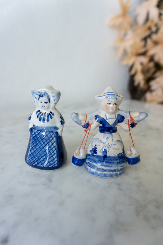  Back view of both Vintage Delft Blue Dutch Figurines, highlighting maker’s mark and craftsmanship.