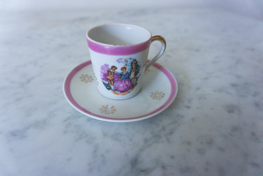 Close-up of the miniature pink Victorian cup and saucer set