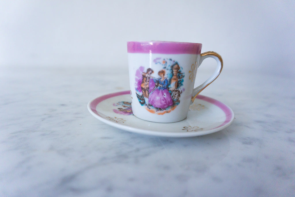 Side view of the miniature cup on the saucer