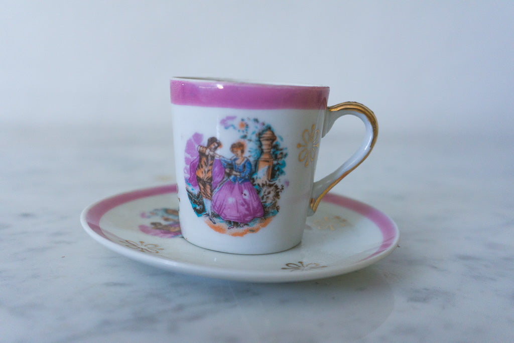 Another angle of the miniature cup and saucer set showing details