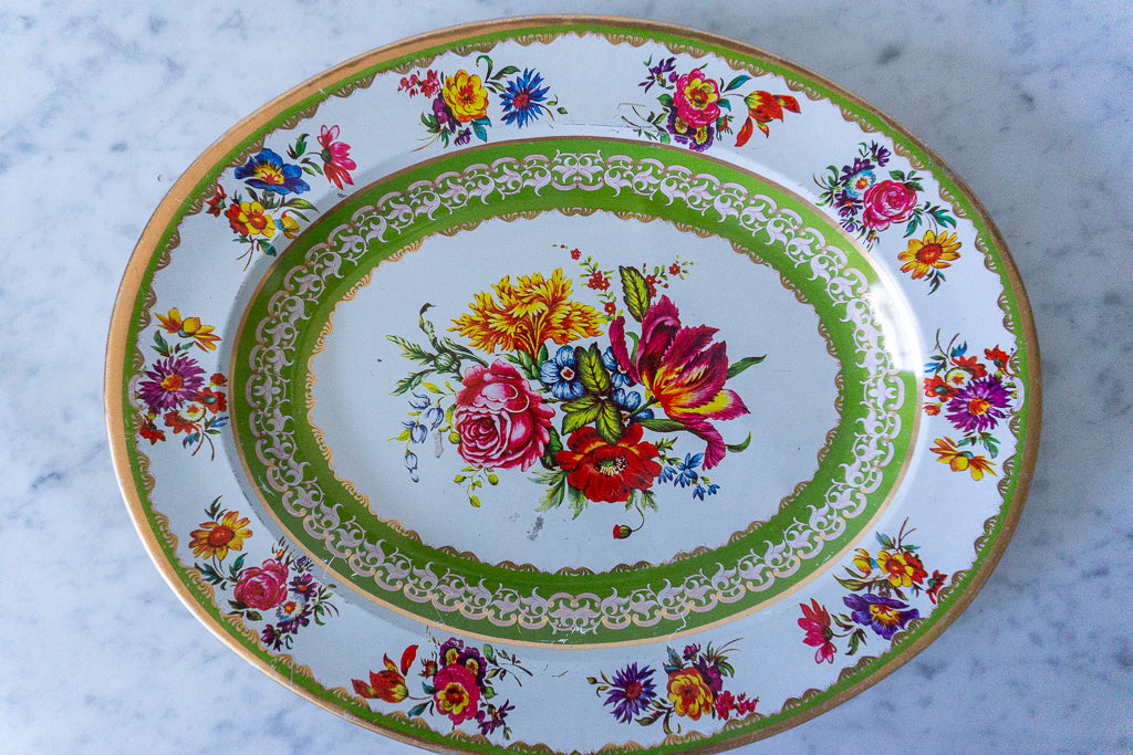 Top view of the Nevco Floral Oval Platter showing the vibrant floral design and ornate green and gold border