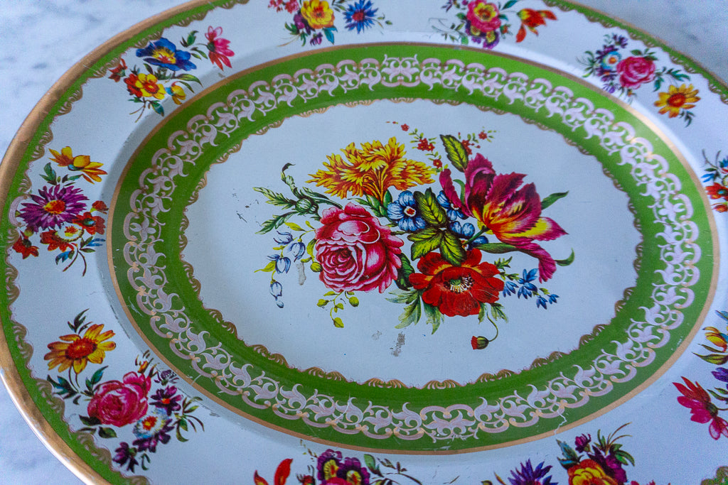 Close-up of the floral design in the center of the Nevco Floral Oval Platter.