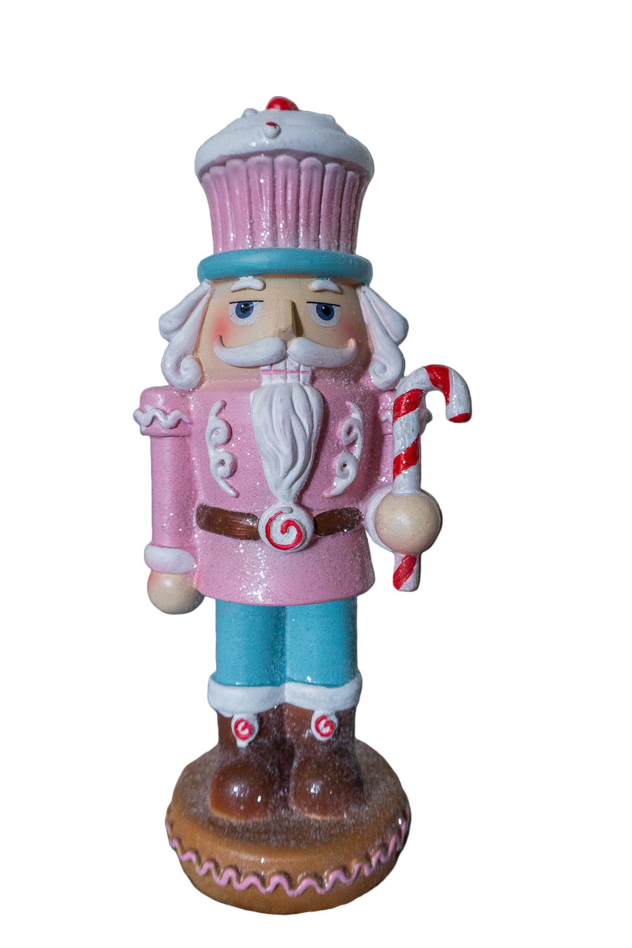 Decorative nutcracker figure with pink outfit and candy cane on a black background