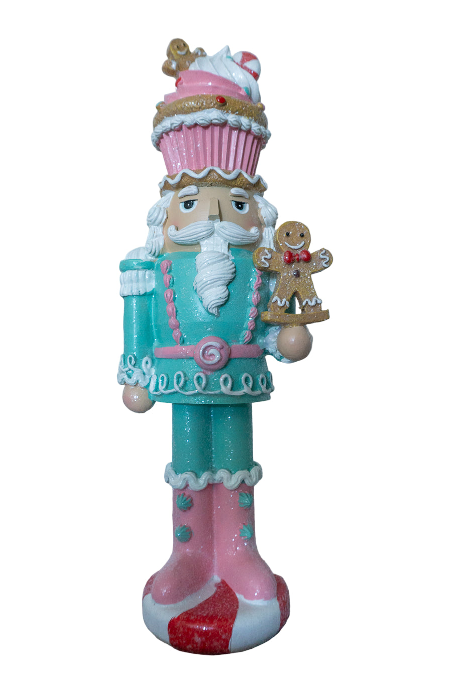 Decorative nutcracker figure with a pink hat and gingerbread man on a white background