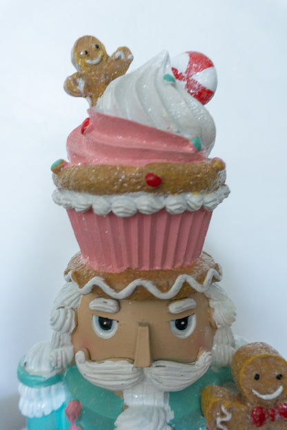 Cupcake Nutcracker Holding Gingerbread