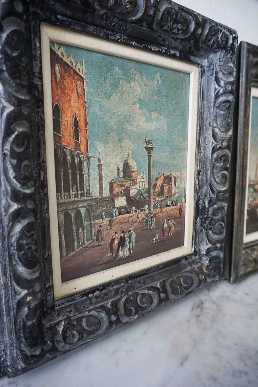 Close-up view of one antique Italian Venetian lithograph, showcasing detailed artwork and an ornate frame.