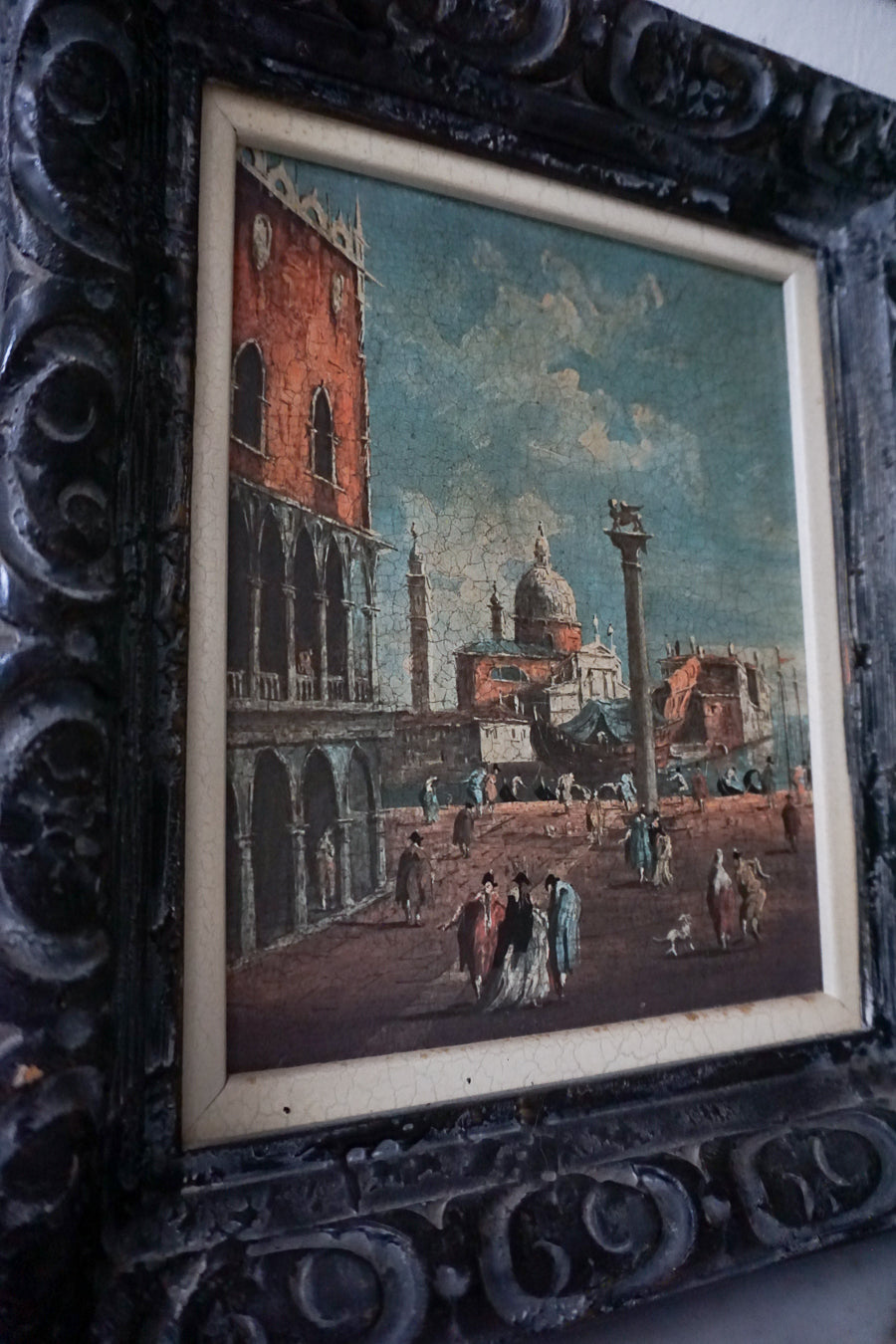 Detailed shot of the first lithograph, highlighting the intricate artwork and vintage frame.