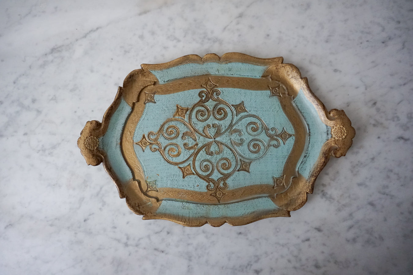 Top view of a handcrafted Italian Florentine decorative tray in blue and gold.