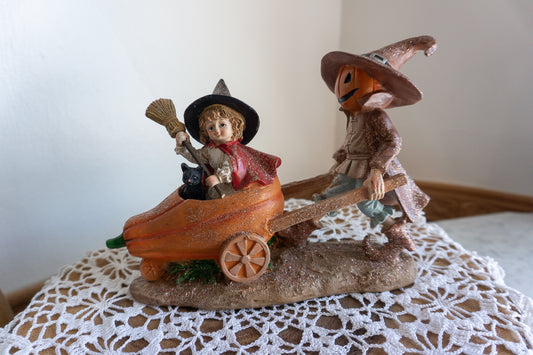 Scarecrow and Child in Wheelbarrow Figurine